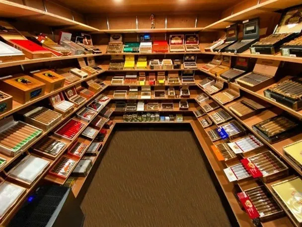 walk in humidor room with stocked cedar shelves