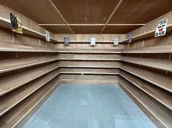 empty cedar shelving inside humidor room